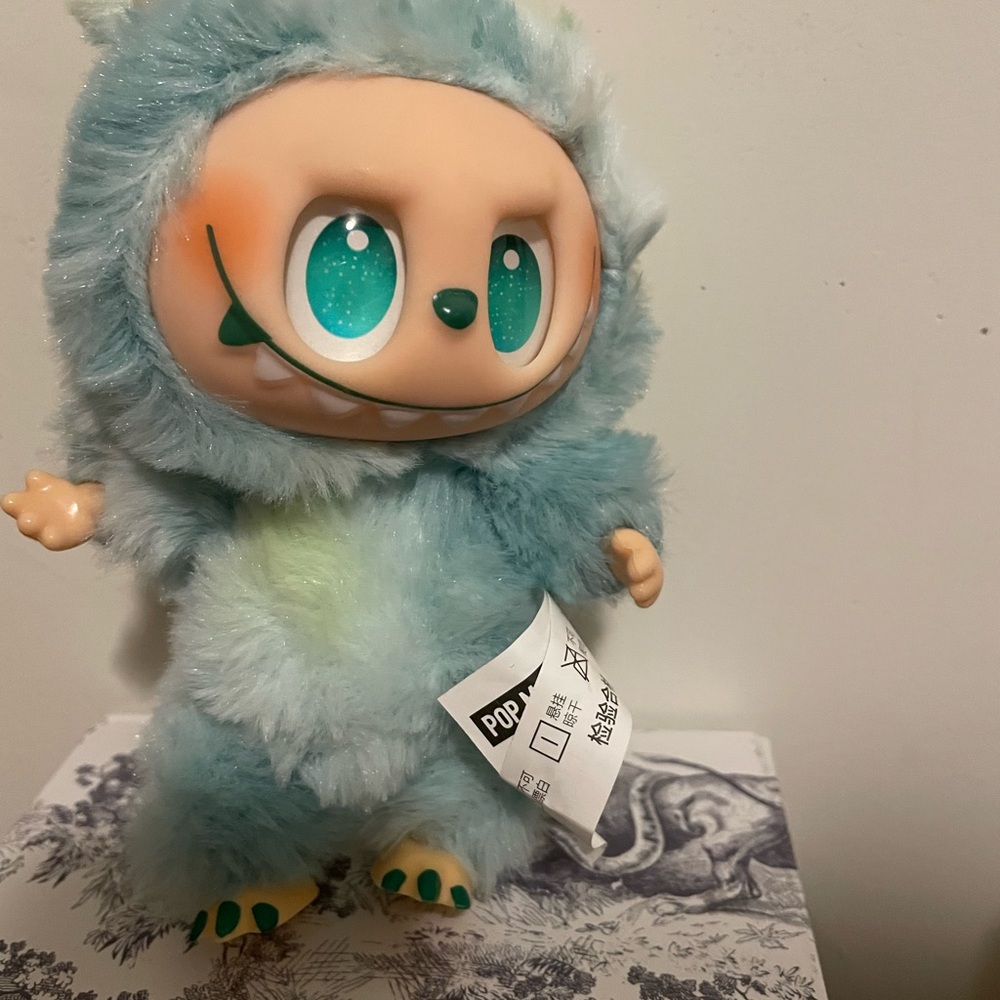 Adorable Blue Furry Toy with Green Eyes